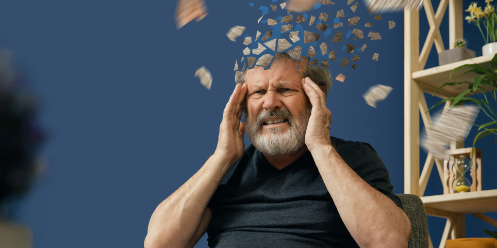 A man holding his head, confused
